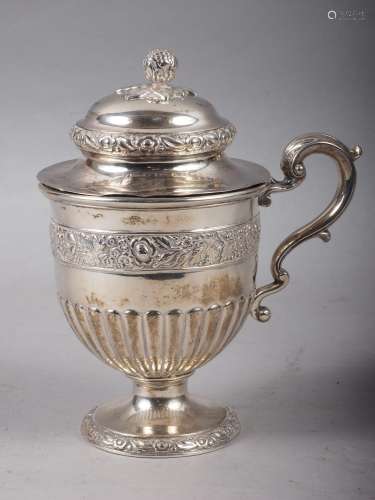 A white metal drinking cup with floral band inscribed, The g...