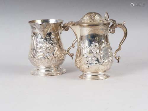 An embossed jug with scroll handle, 11.9oz troy approx, and ...