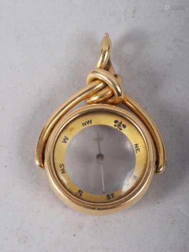 An 18ct gold fob swivel inset compass, 14.5g gross