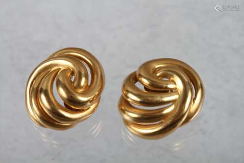 A pair of yellow metal spiral ear clips, stamped 18K, 39.7g