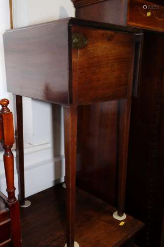 A 19th century mahogany bedside cupboard with drop front and...