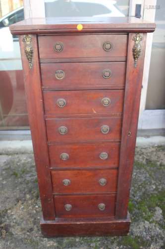 A 19th century Wellington chest of seven graduated long draw...