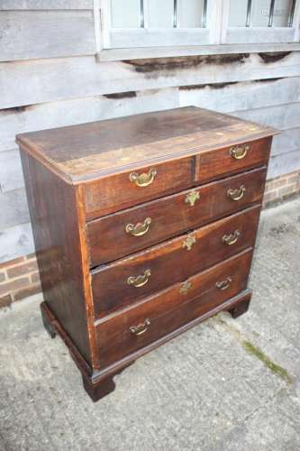 An 18th century oak chest of two short and three long gradua...