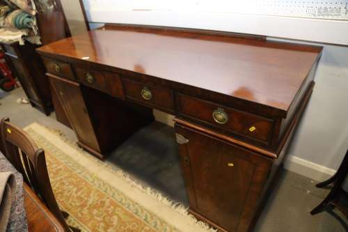 A William IV figured mahogany double pedestal sideboard, fit...