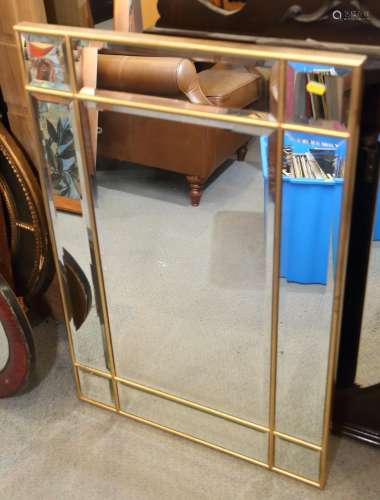 A rectangular gilt framed sectional wall mirror with nine pl...