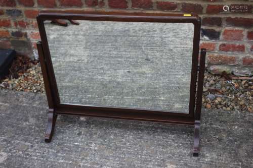 A 1930s mahogany rectangular swing frame toilet mirror, on s...