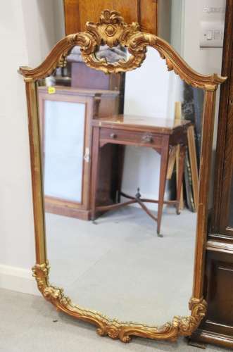 A gilt scroll framed wall mirror, plate 42 x 24