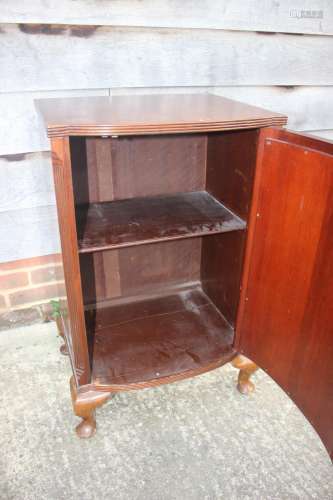 A mahogany bowfront cupboard enclosed shelf, on cabriole sup...