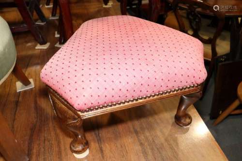 A polished as walnut triangular top stool, on cabriole suppo...
