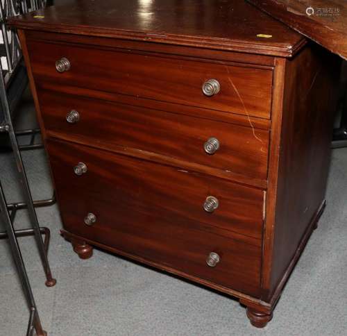 A mahogany bedside chest, fitted two deep drawers with brass...