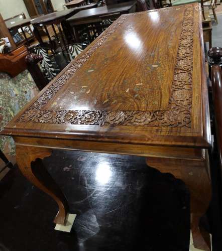 A carved sheesham brass and copper inlaid coffee table, on c...