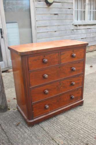 A mahogany chest of two short and three long drawers with kn...