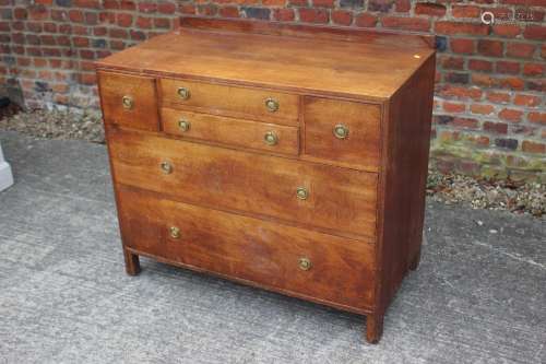 A Maples oak chest of two shallow, two deep and two long gra...