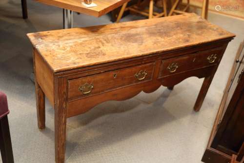 A 19th century waxed pine low side table, fitted two drawers...