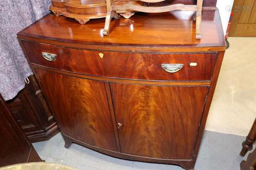 A mahogany and satinwood bowfront side cupboard, fitted two ...