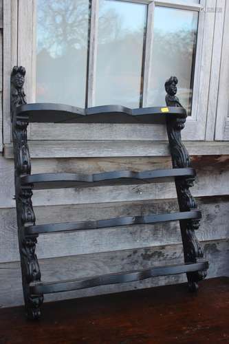 A carved and ebonised four-tier open wall shelf of 17th cent...