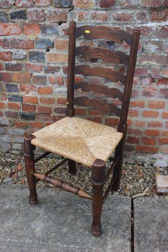 A chestnut ladder back chair with rush envelope seat, a simi...