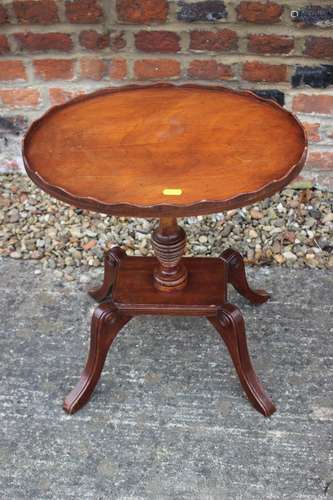 A polished as mahogany oval gallery top occasional table, on...