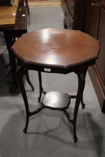 An Edwardian mahogany shaped octagonal top two-tier occasion...