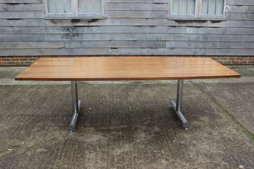 A Tim Bates 1970s shape top rosewood dining table, on chrome...