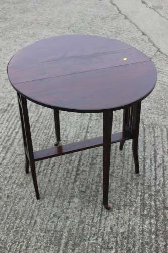 An early 20th century oval Sutherland table, on vertical rai...