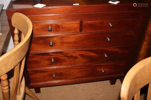A 1960s mahogany chest of two short and three long drawers w...