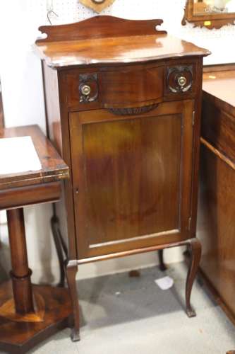 A mahogany serpentine front music cabinet with ledge back, f...