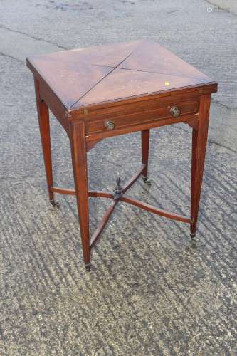 An Edwardian rosewood and inlaid envelope top card table, on...