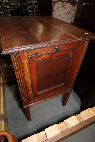 An early 20th century oak record cabinet with drop down fron...