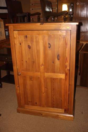 A waxed pine cupboard, fitted adjustable shelves enclosed pa...