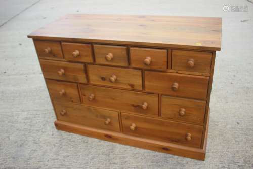 A waxed pine chest of four small drawers, three short drawer...