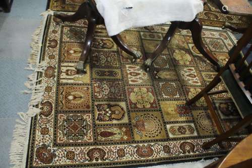 A Persian garden style rug, in shades of blue, brown, fawn, ...