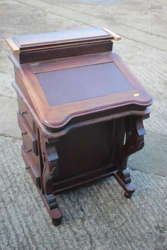 A carved hardwood Davenport desk, the interior fitted two dr...