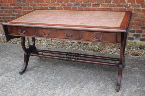 A mahogany sofa table/desk with leather inset top, fitted th...