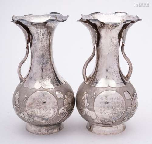 A pair of Chinese silver vases, stamped marks: bears Chinese...
