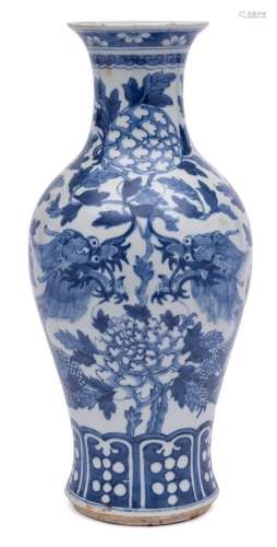 A Chinese blue and white dragon vase: of baluster form,