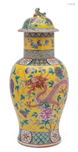 A Chinese famille rose yellow ground baluster vase and cover...