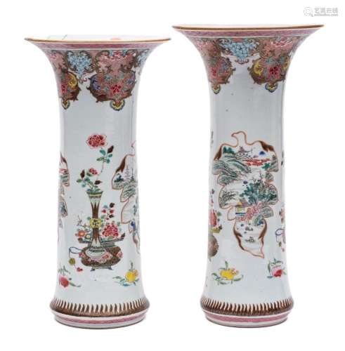 A large graduated pair of Chinese famille rose sleeve vases:...