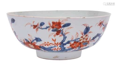 A Chinese Imari bowl: painted with knarled branches of bloss...