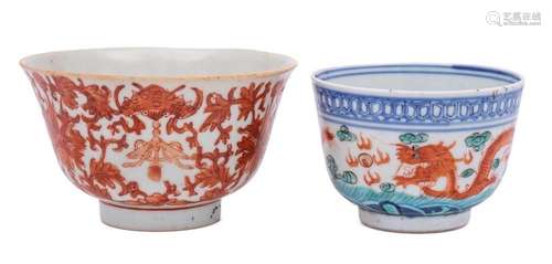 Two Chinese bowls: the first enamelled in iron-red with lotu...