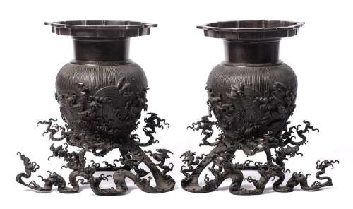 A pair of Chinese bronze vases and stands: each of ovoid for...