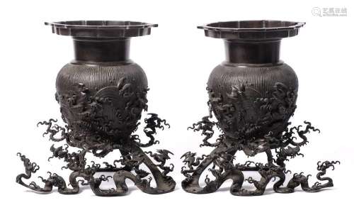 A pair of Chinese bronze vases and stands: each of ovoid for...