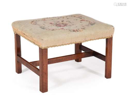 A George III mahogany and upholstered stool in the manner of...