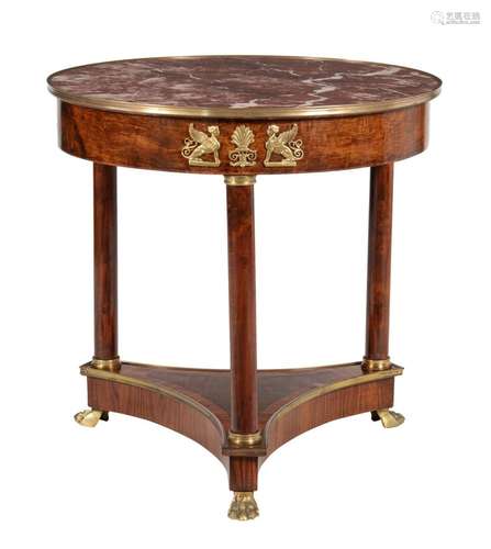 A mahogany and marble topped centre table in Empire style