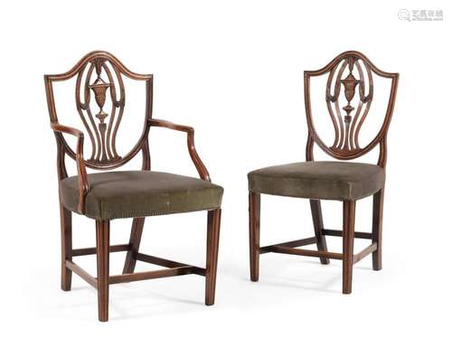 A set of twelve dining chairs in George III style