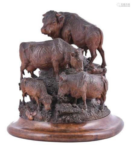 A 'Black Forest' carved walnut model of a herd of ca...