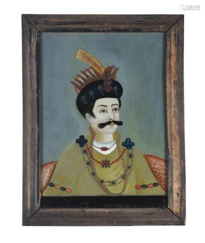 A reverse painted glass portrait of a gentleman in Indian dr...