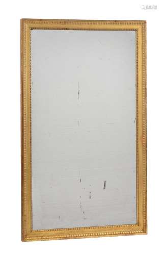 A giltwood rectangular wall mirror in Louis XVI style