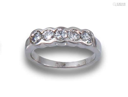 18kt white gold band with brilliant-cut diamonds set in chat...