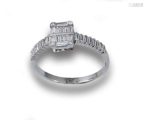 Ring in 18kt white gold with a baguette and brilliant-cut di...